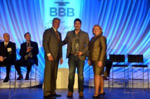 Jabez LeBret, co-founder of GNGF, accepting the BBB Torch Award