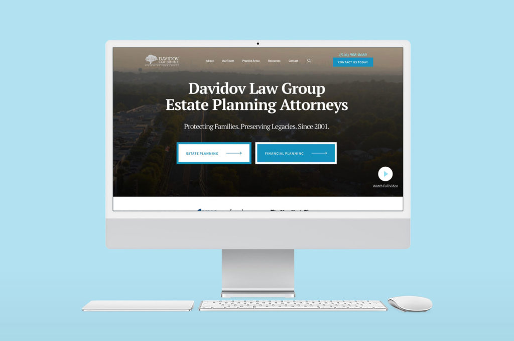 Big monitor on a plain blue background showcasing Davidov Law Group's website